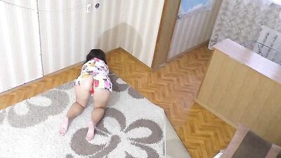 Milf kneels in a short dress and waits for anal sex