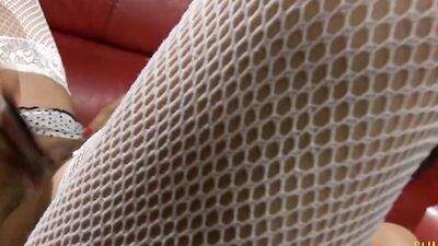 Hot brunette chick takes care of a thick dick on the couch