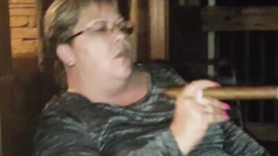 Amateur mature is smoking a cigarette in front of the camera