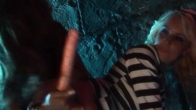The lesbian jail guard has fun with her blonde prisoner as she brings her dildos to her cell