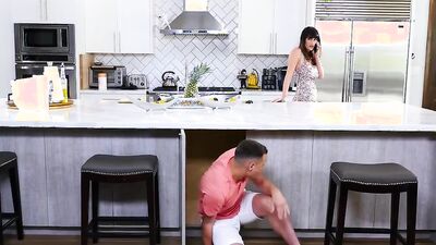 Gorgeous tattooed MILF is riding her stepson's pecker in the kitchen