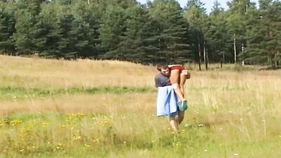 Cute doll is riding fellow's prick out in the fields