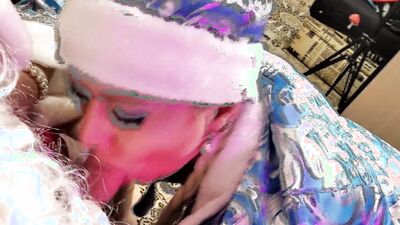 Cock hungey babe gives some juicy bj to a Santa Clause