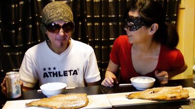 Amateur Asian couple is eating lunch in front of the camera