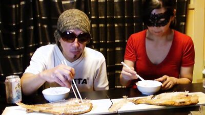 Amateur Asian couple is eating lunch in front of the camera