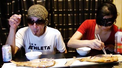 Amateur Asian couple is eating lunch in front of the camera