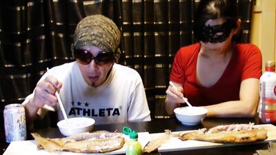 Amateur Asian couple is eating lunch in front of the camera