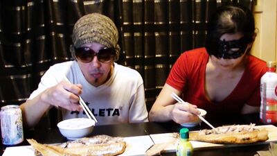 Amateur Asian couple is eating lunch in front of the camera
