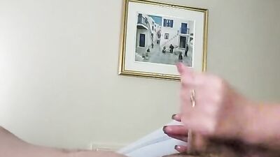 Dude films himself while stroking his hard pecker in the bedroom