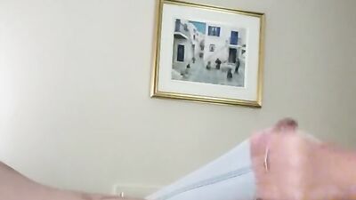 Dude films himself while stroking his hard pecker in the bedroom